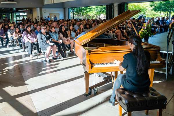 Pianist performer in Campus Center with audience