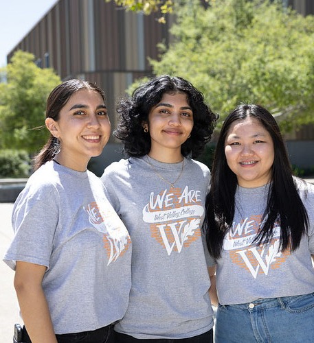 Three female students smiling