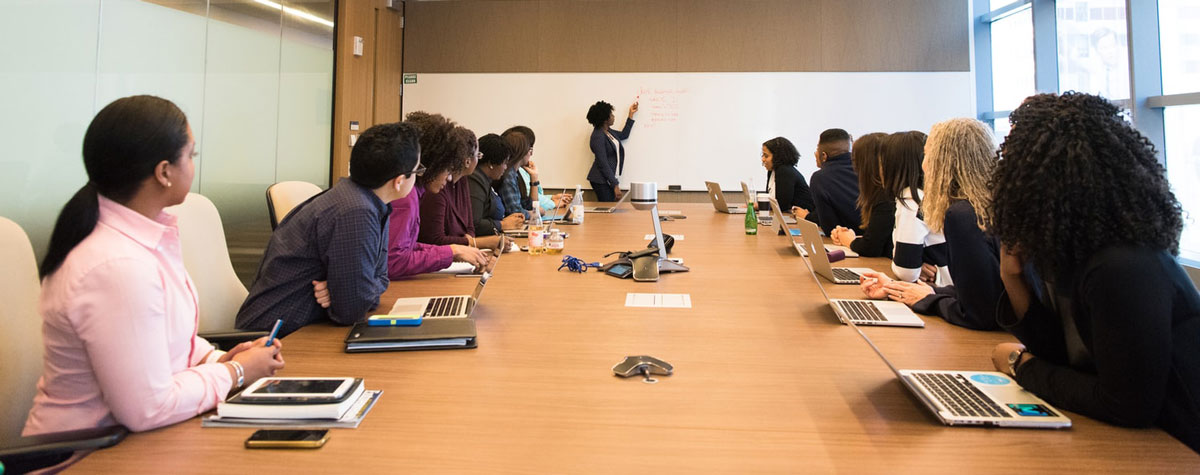 Group gathered in front of white screen